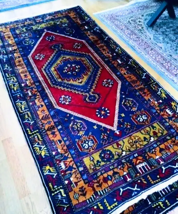 El dokuma yün halı